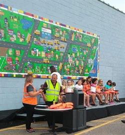 Fourteen students and three teachers were involved in the creation of the “First Student Children’s Mural”