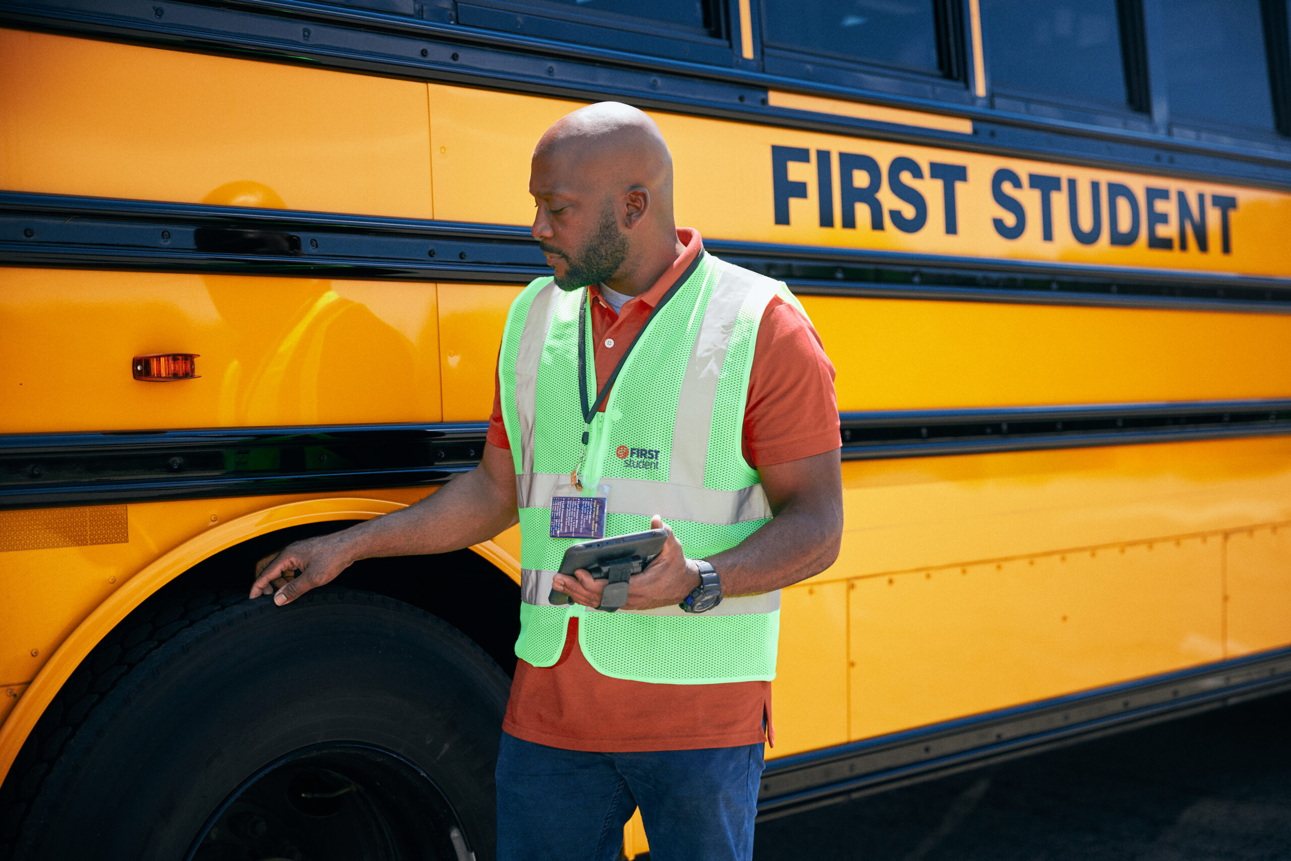 Driver Inspecting Bus