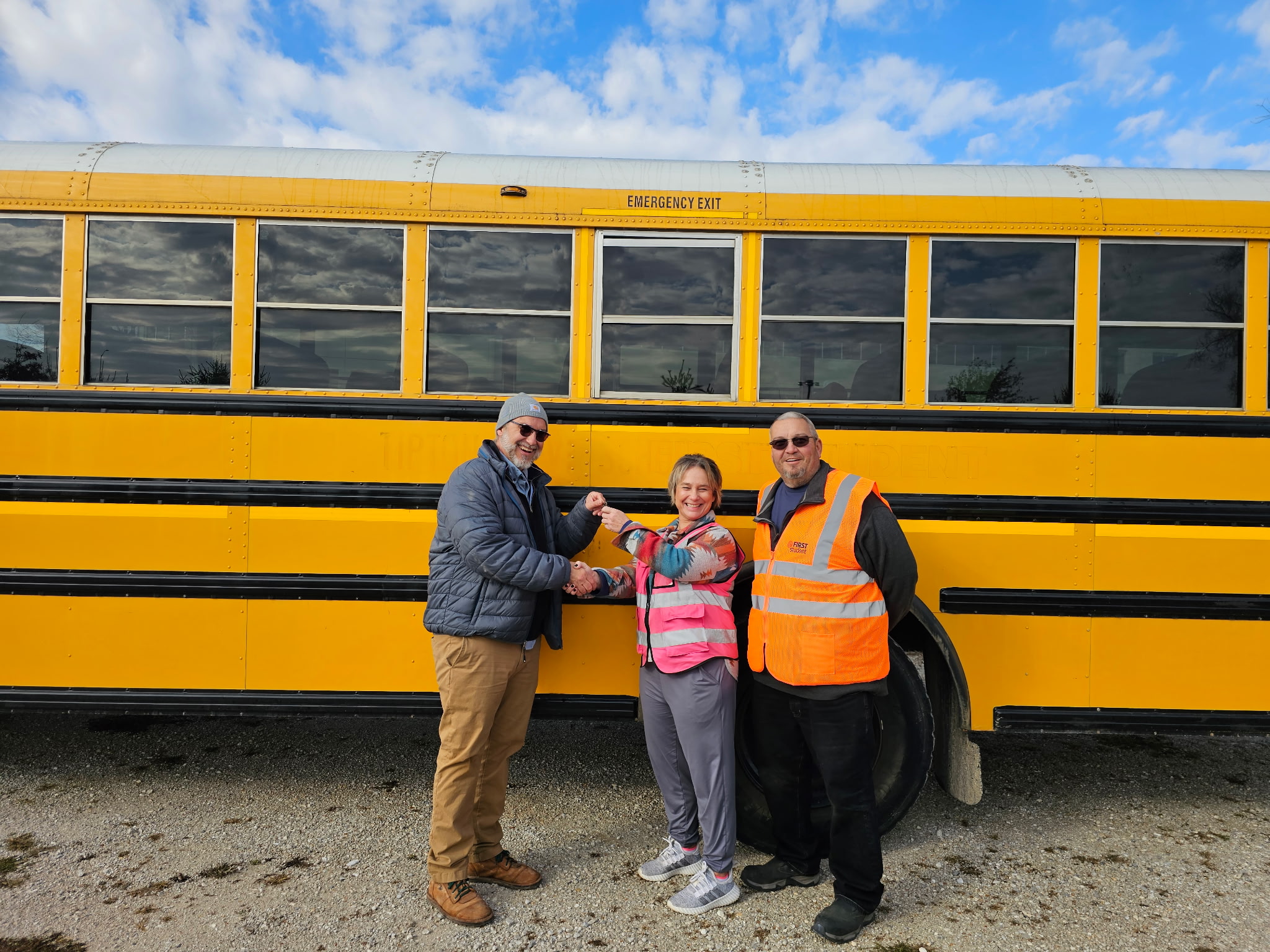 Eden Village workers with First Student bus