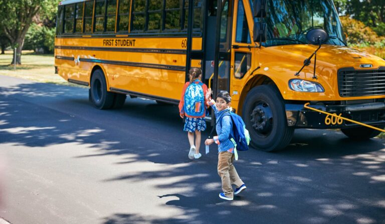first student smiling boarding min